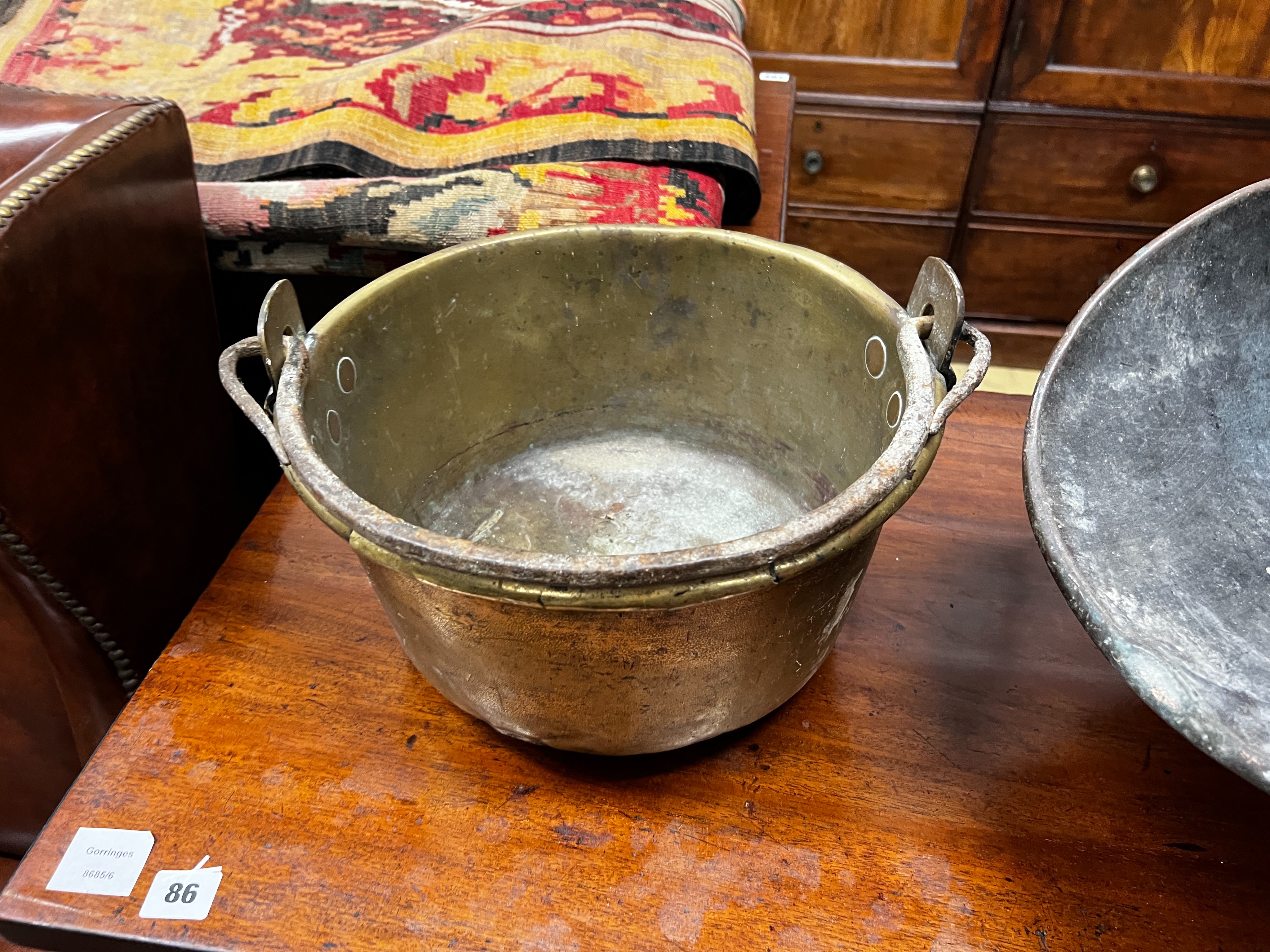 A Victorian copper coal scuttle and a brass preserving pan